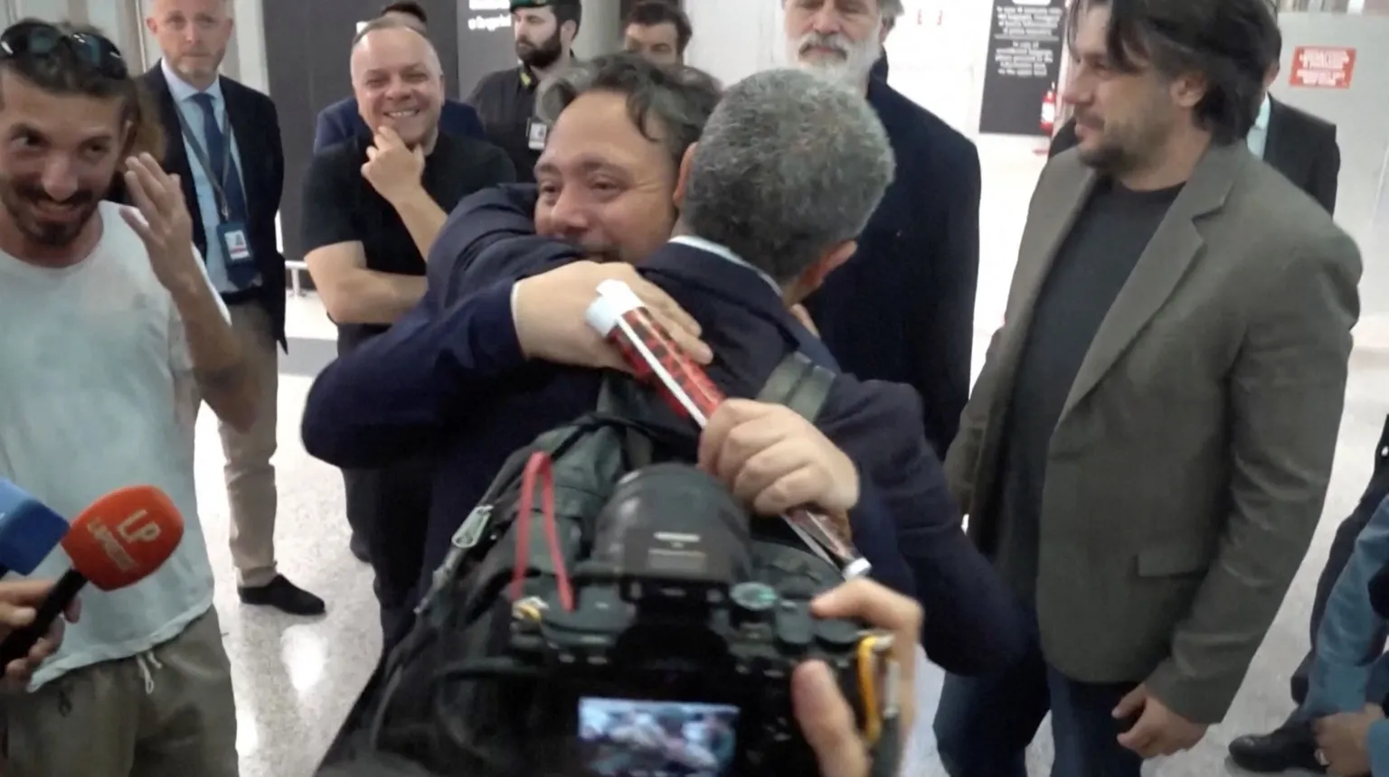 Reuters Italian lawmaker Dario Carotenuto is embraced by a relative 